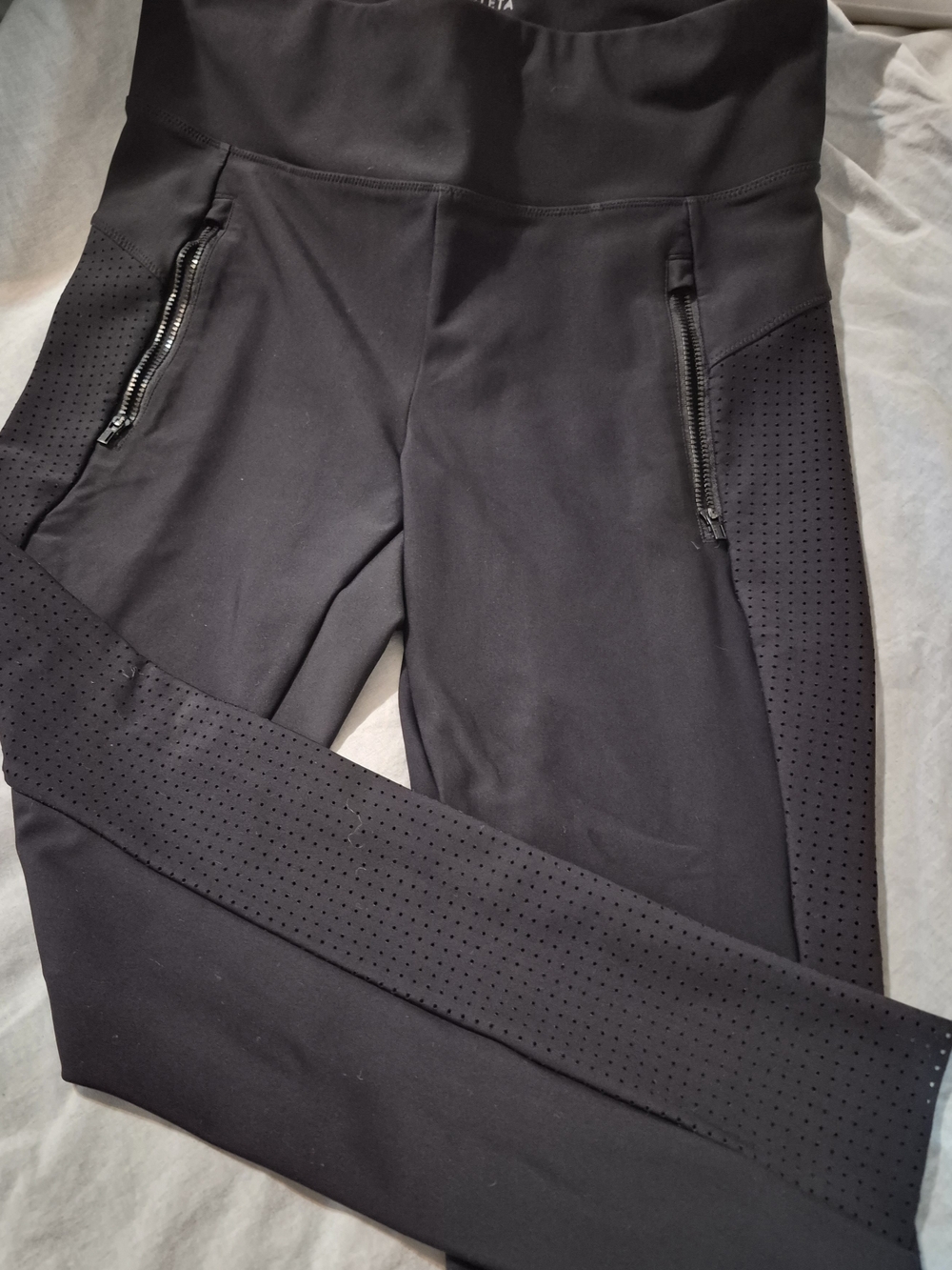 Athleta Black Perforated High-Rise Leggings with Zip Pockets